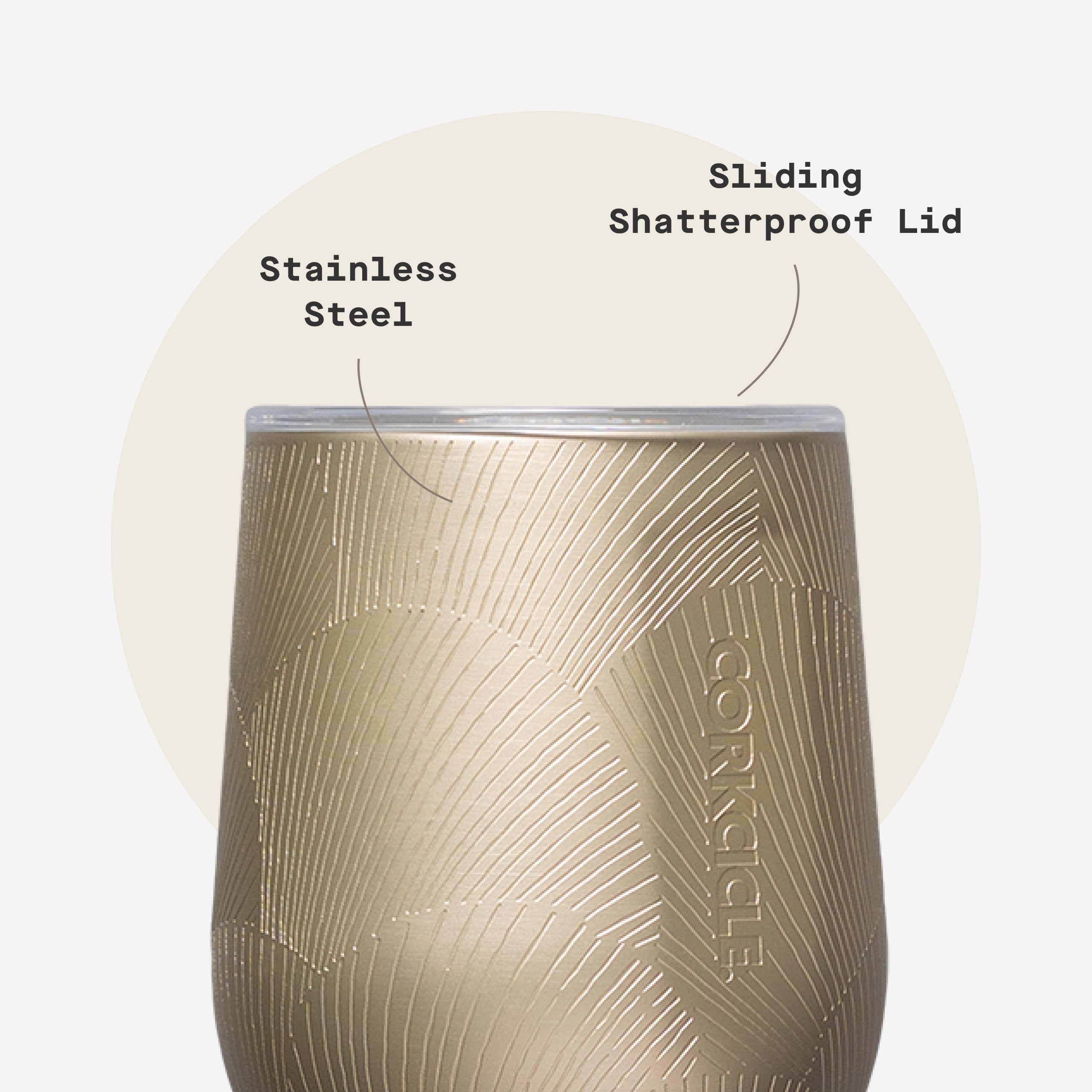 Hand holding Corkcicle tumbler for scale showing portable 12 oz convenience