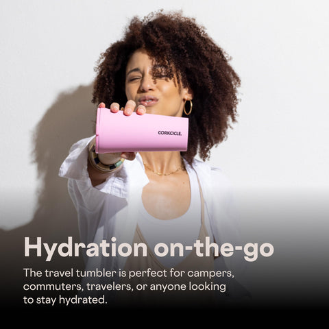 Hand holding Corkcicle showing ergonomic shape and travel comfort