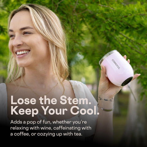 Corkcicle beside a smartphone to show 12oz scale and travel-friendly size