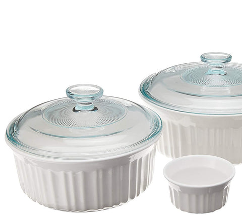 CorningWare stacked dishes with glass and plastic lids highlighting space-saving storage benefit