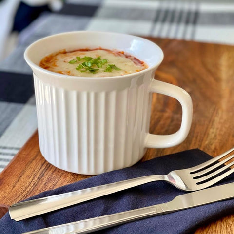 CorningWare mug in use with soup, demonstrates easy transport benefit