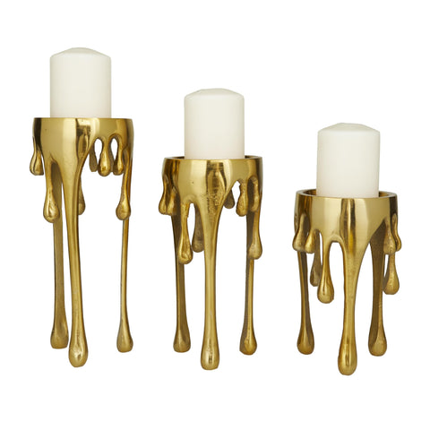 CosmoLiving front view of three gold candle holders showing modern silhouette and balance