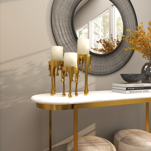 CosmoLiving trio on dining table demonstrating layered heights and centerpiece use
