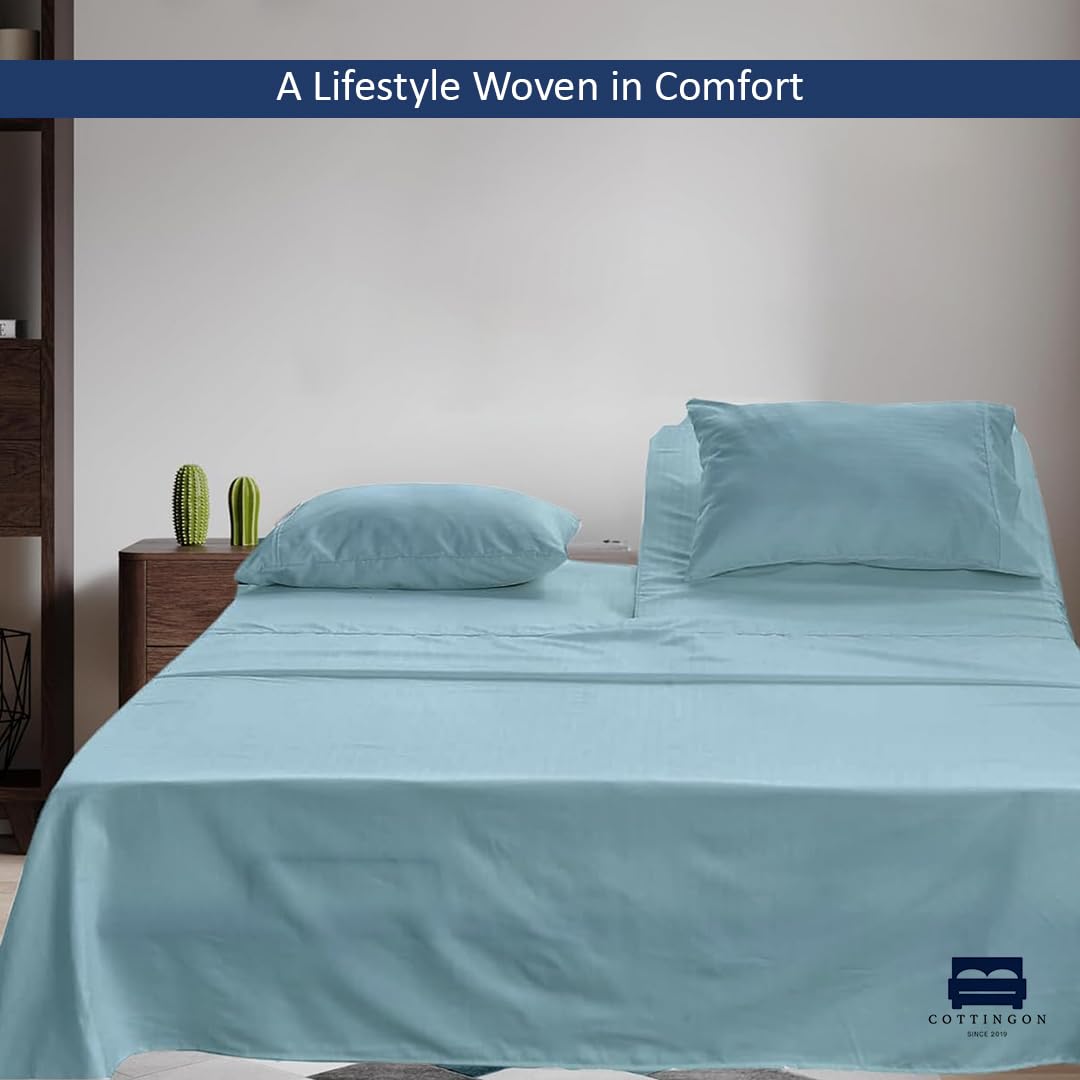 Cottingon flat sheet spread on king bed demonstrating full coverage and smooth finish