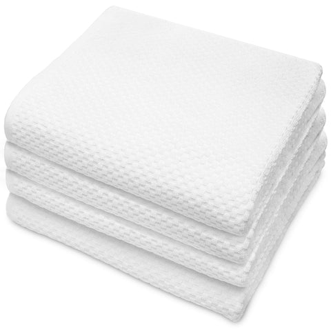 COTTON CRAFT front view of four white towels showing neat spa-like presentation and quick-dry benefit