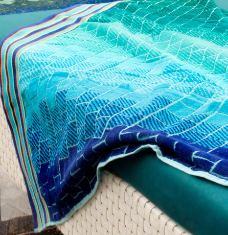 COTTON CRAFT towel on a beach chair comparing size for clear scale and generous fit