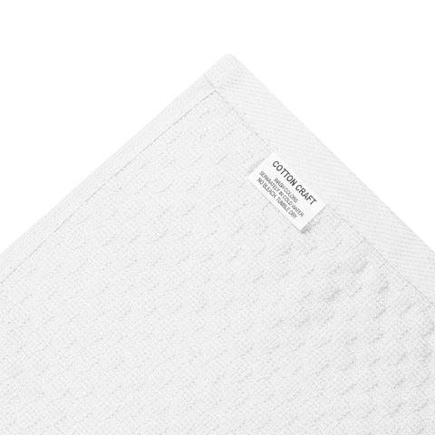 COTTON CRAFT neatly folded stacked towels illustrating organized storage benefit