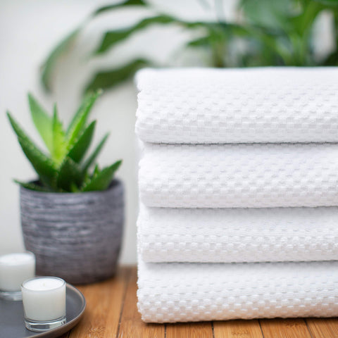 COTTON CRAFT towel draped over person after shower showing full coverage and absorbent comfort
