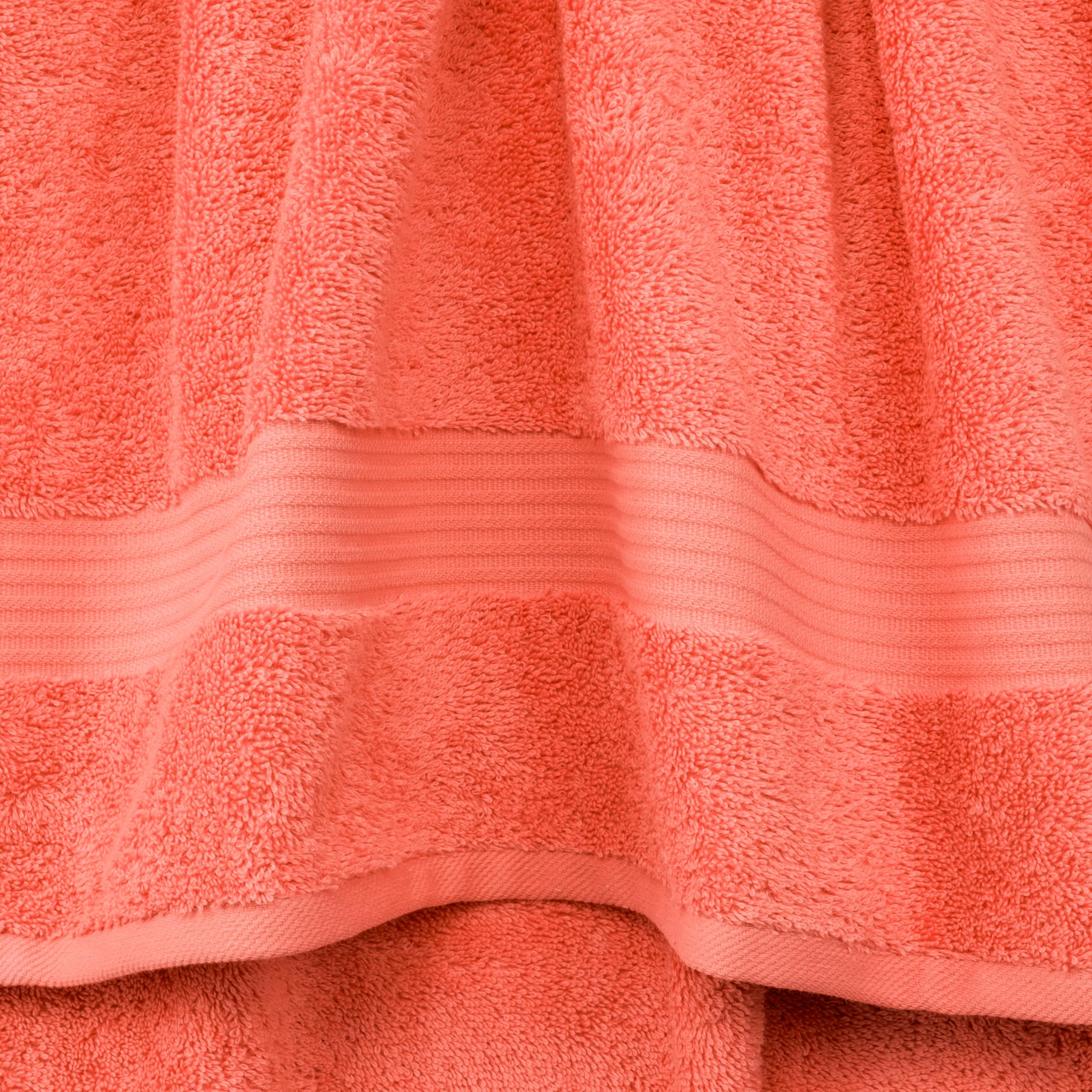 Cotton Paradise folded bath towel on shelf showing plush thickness and neat storage benefit