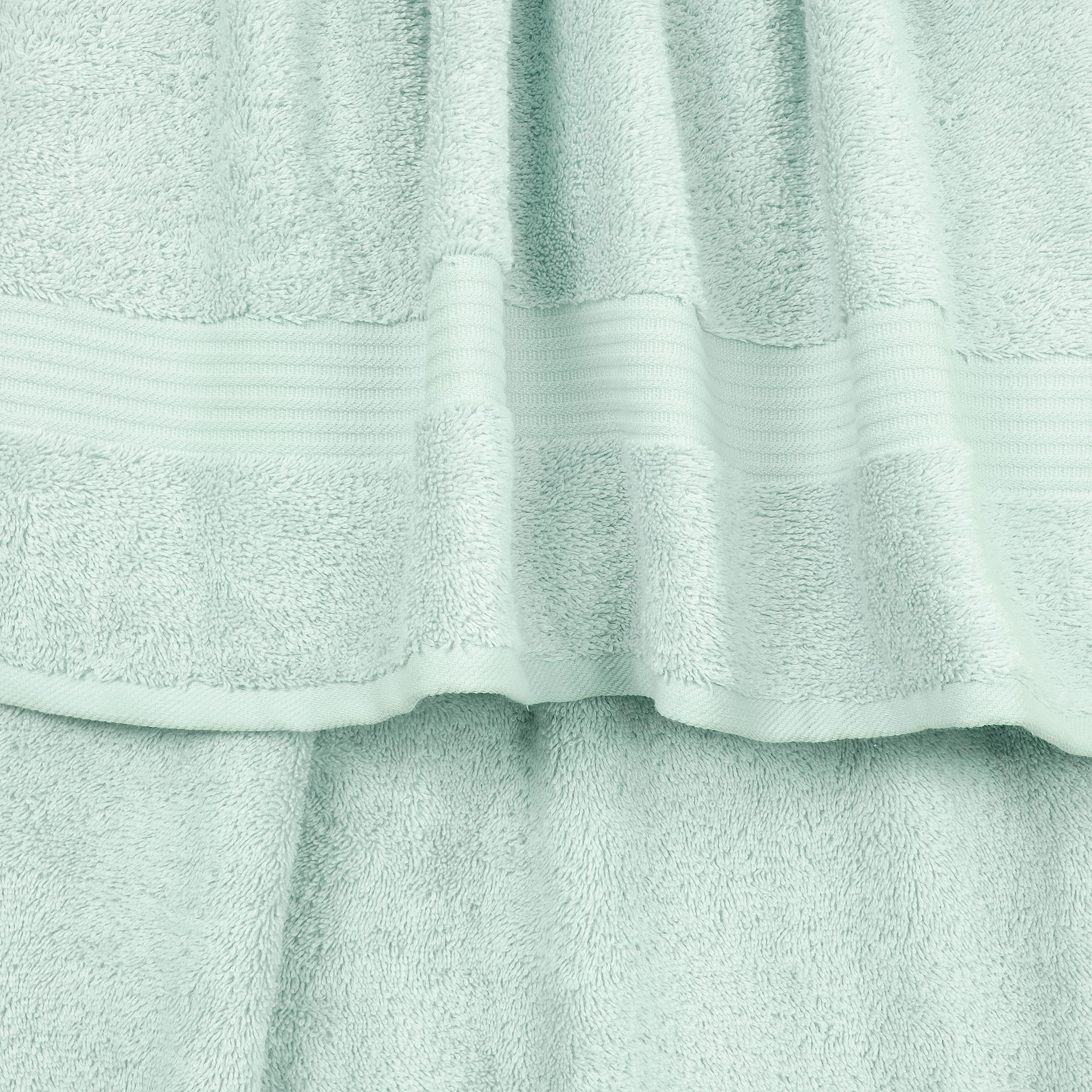 Cotton Paradise towel stack texture close-up highlighting plush weave and absorbency