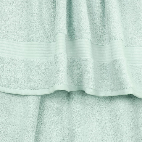 Cotton Paradise towel stack texture close-up highlighting plush weave and absorbency