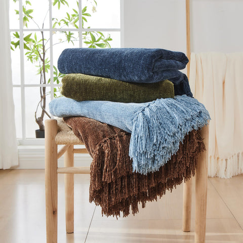 CozeCube draped on bed demonstrating layering effect and room-enhancing color