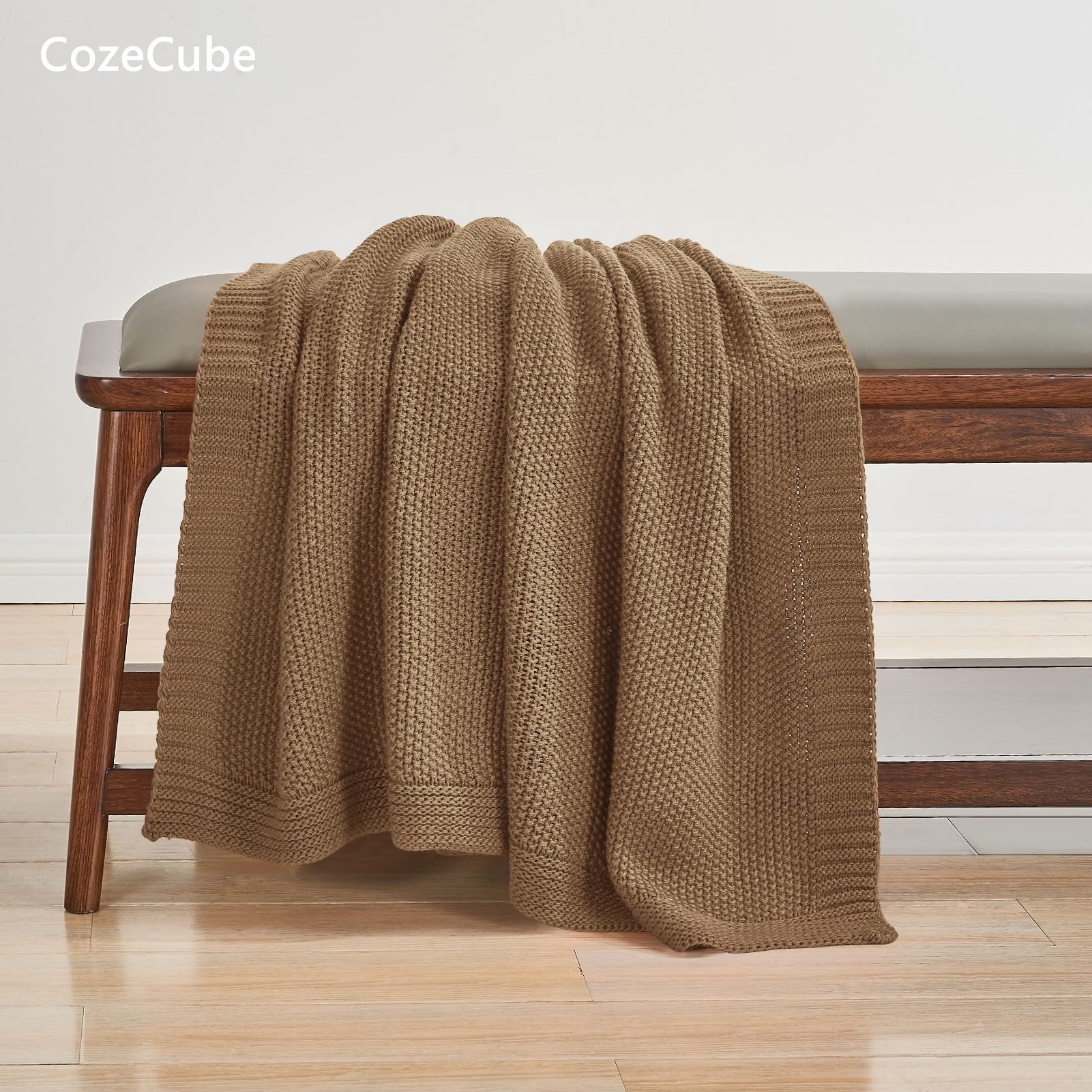 CozeCube draped over sofa arm adding instant living room warmth