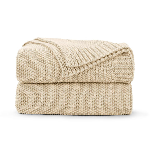 CozeCube throw folded front view showing light beige color and cozy appeal