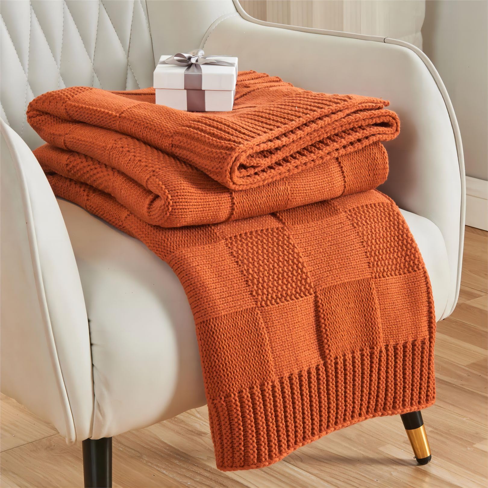 CozeCube front folded throw showing rust orange color and neat fold, enhances couch décor