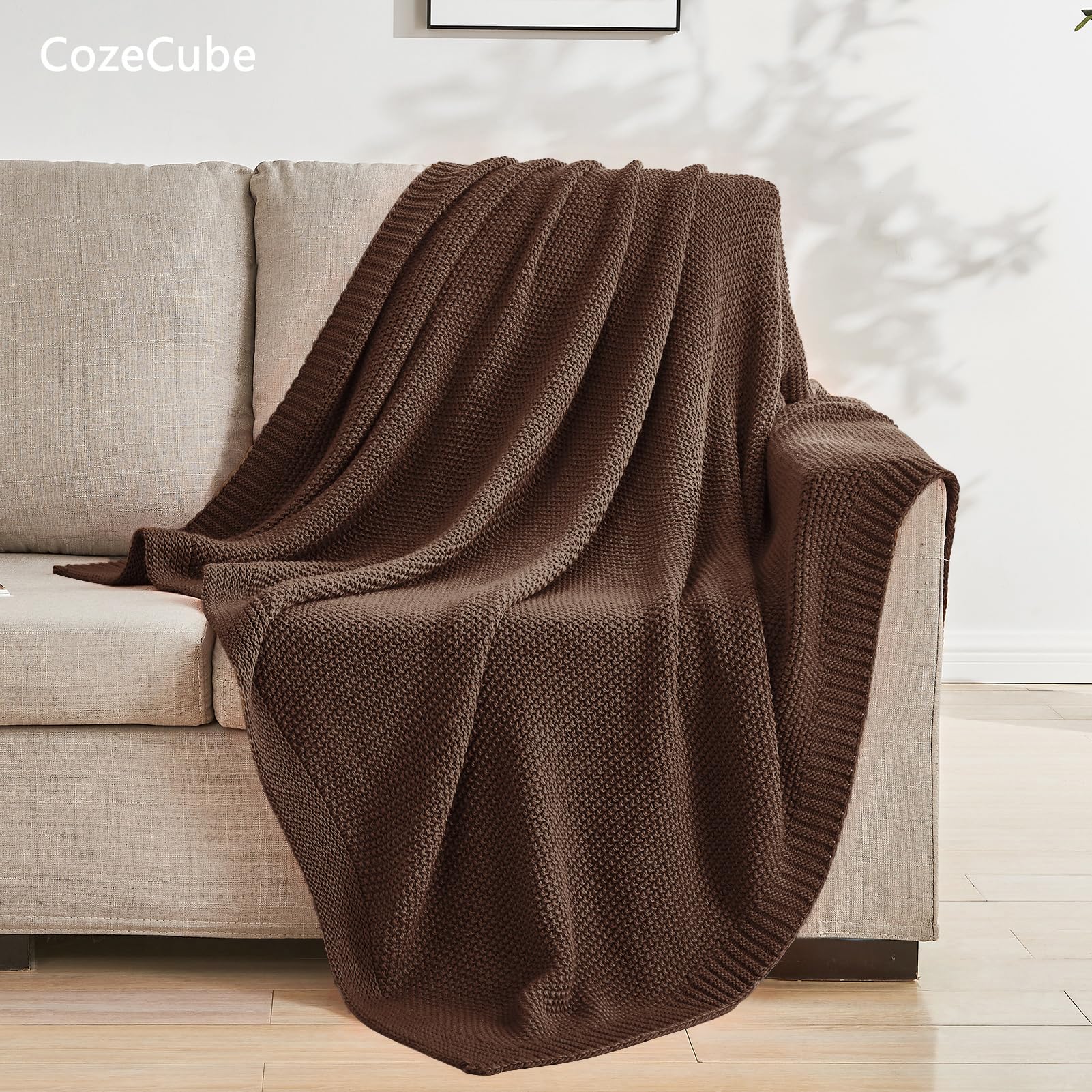 CozeCube throw draped over sofa illustrating farmhouse style and extra warmth