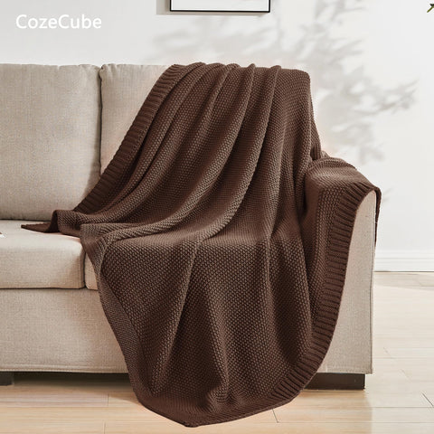CozeCube throw draped over sofa illustrating farmhouse style and extra warmth