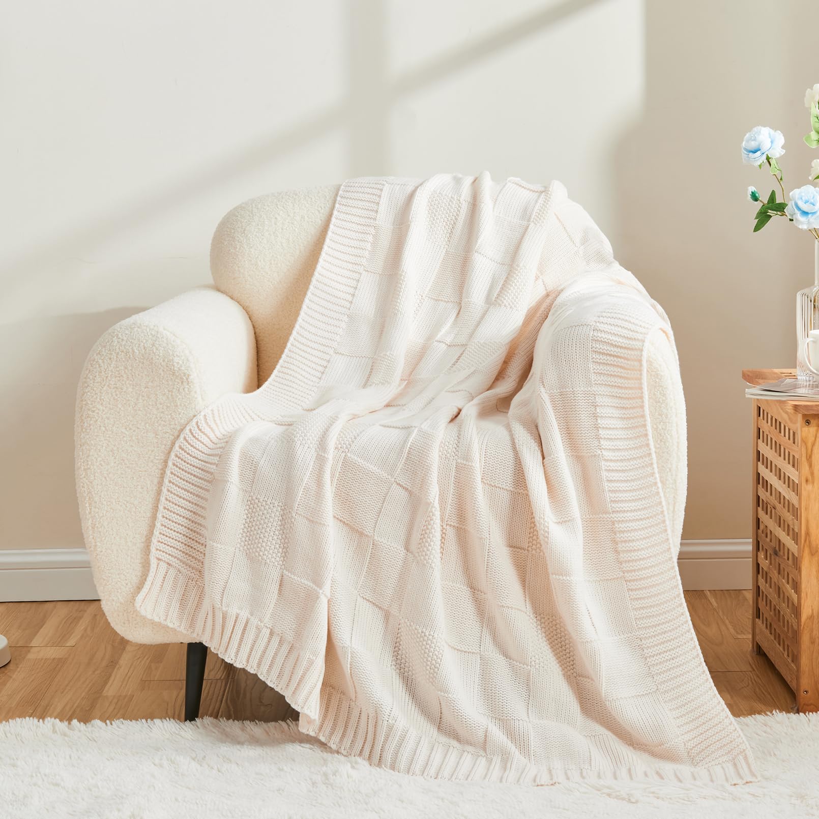 CozeCube throw draped on sofa in living room adding cozy layered warmth to seating