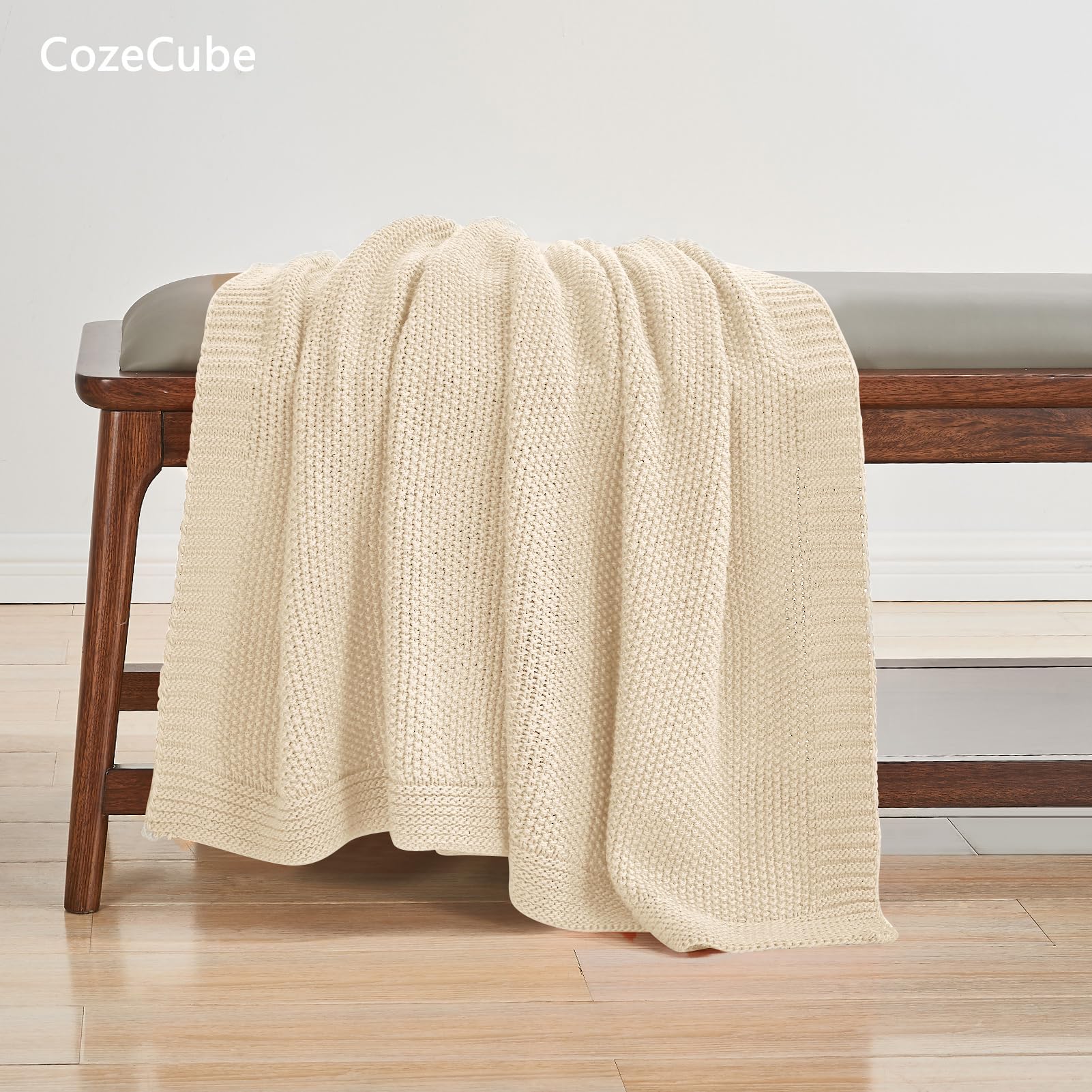 CozeCube throw folded at foot of bed creating layered cozy bedroom styling