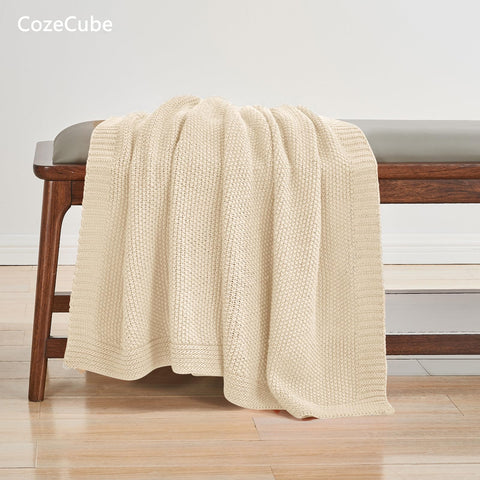 CozeCube throw folded at foot of bed creating layered cozy bedroom styling