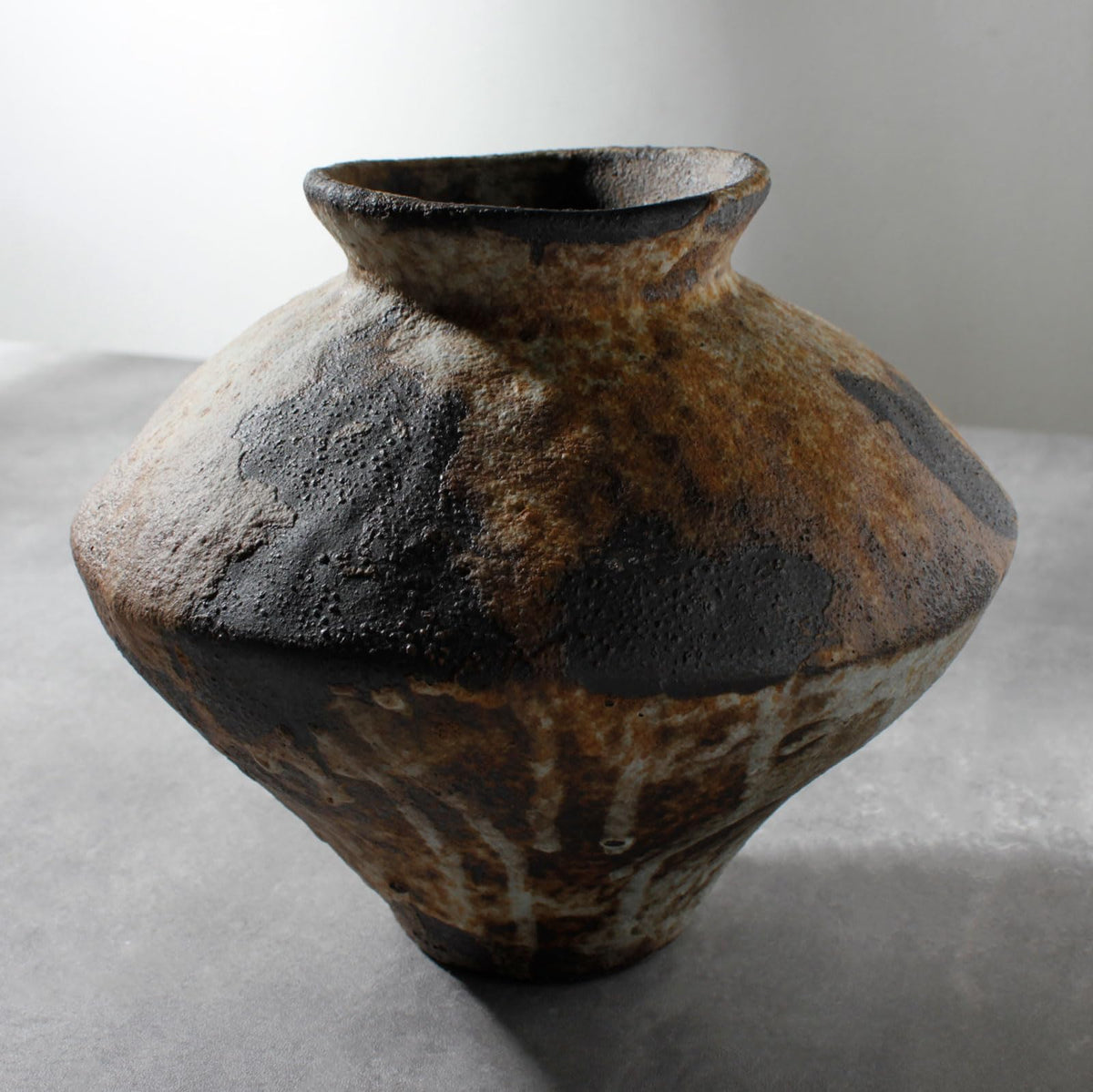 COZLIV vase front view showcasing rustic finish and subtle silhouette