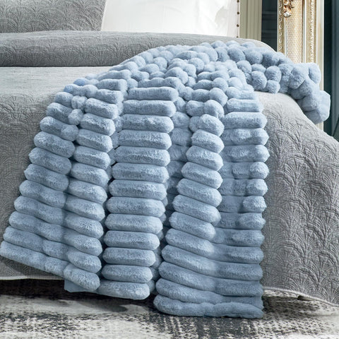 Cozy Bliss folded blanket on shelf showing compact storage ease