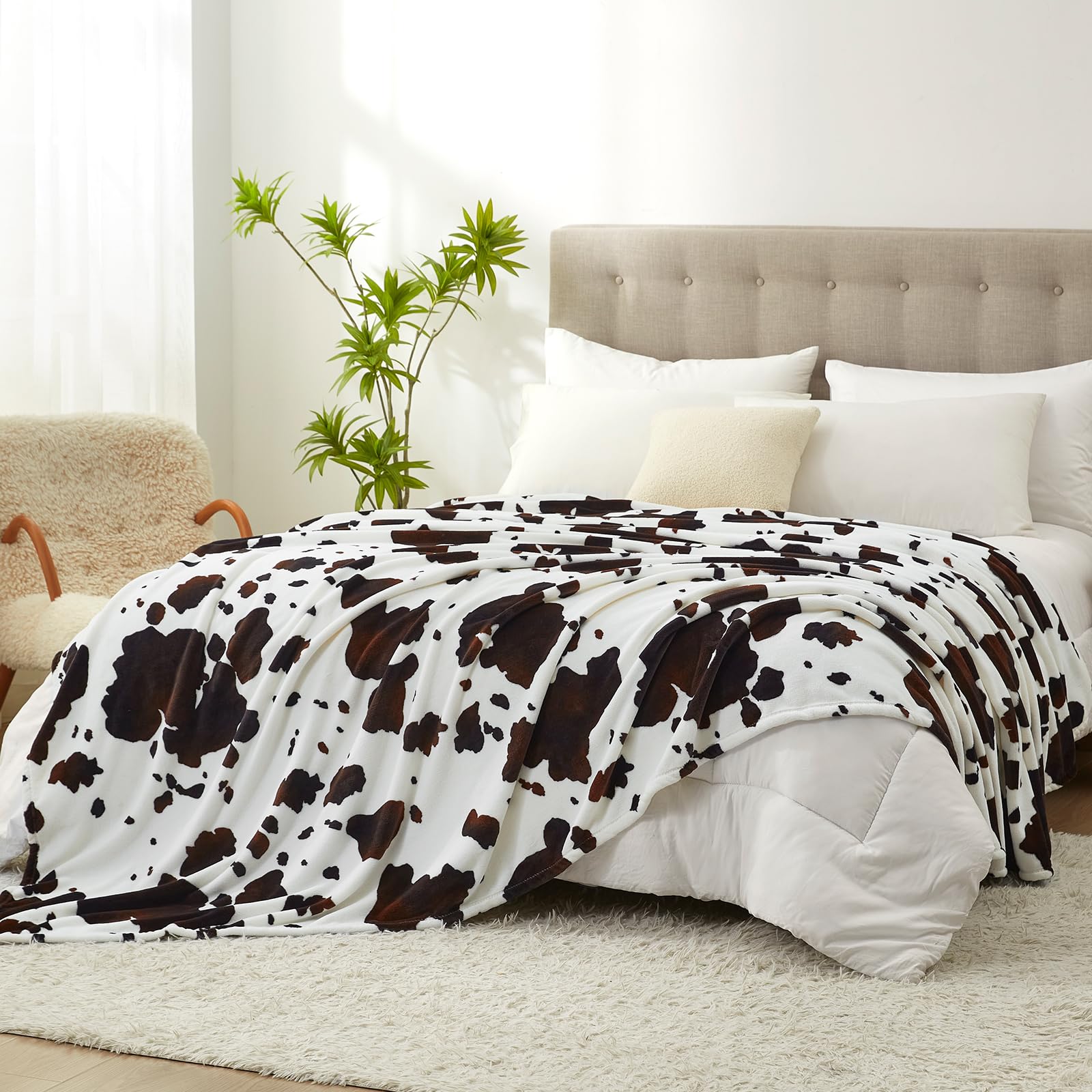 Cozy Bliss front view showing cow print and large queen coverage for stylish warmth