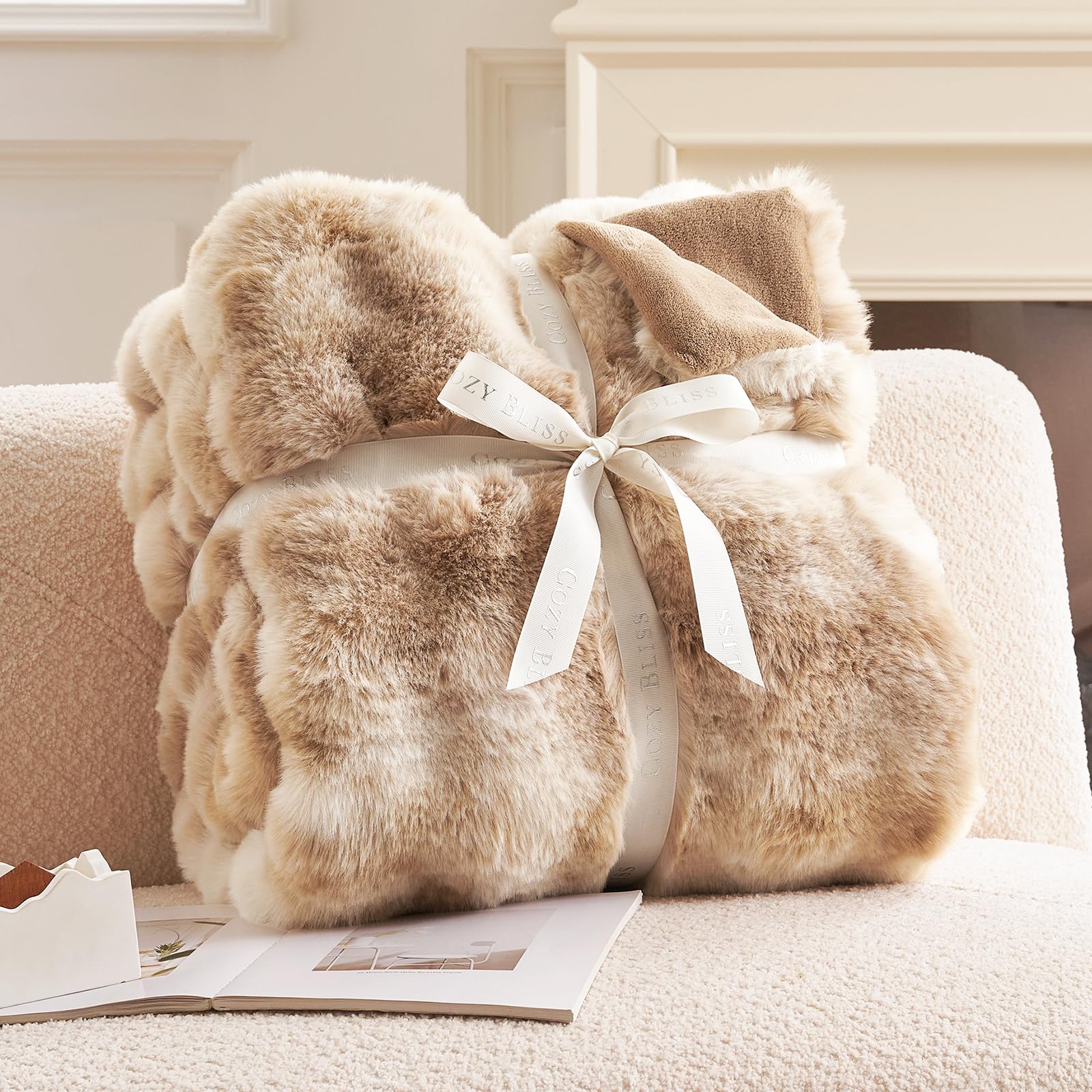 Cozy Bliss throw draped on sofa in living room, adding cozy layered style