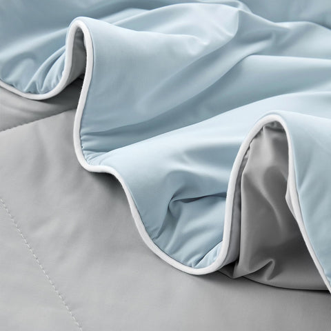 Cozy Bliss edge stitching close-up demonstrating single-needle construction stability