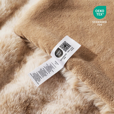 Cozy Bliss folded on bed to show size and scale for one-person coverage