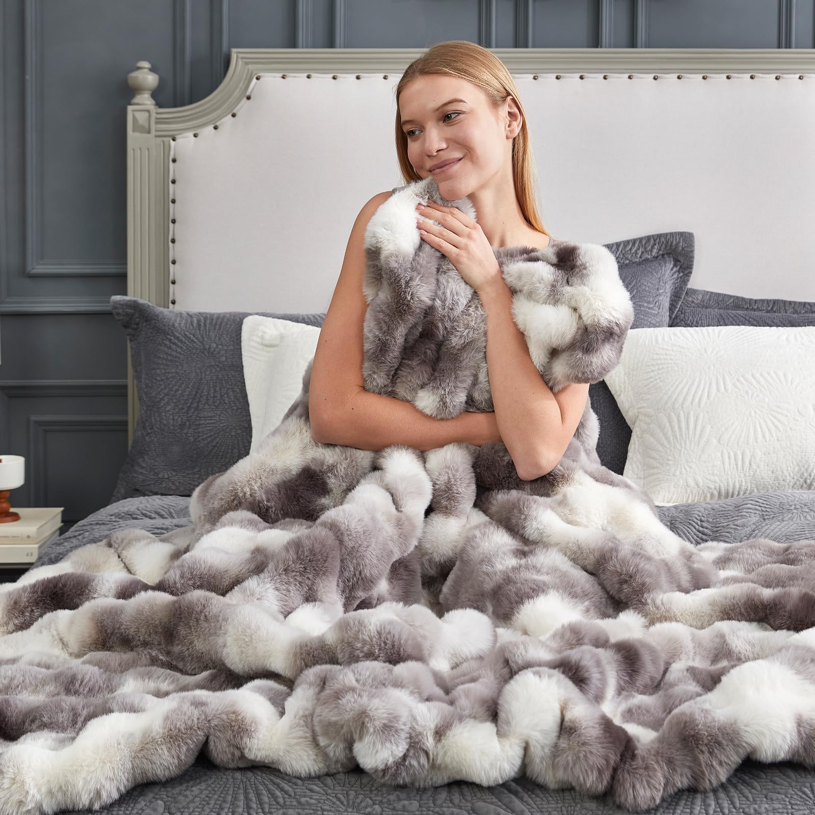 Cozy Bliss folded throw on sofa demonstrating stylish, cozy living room accent
