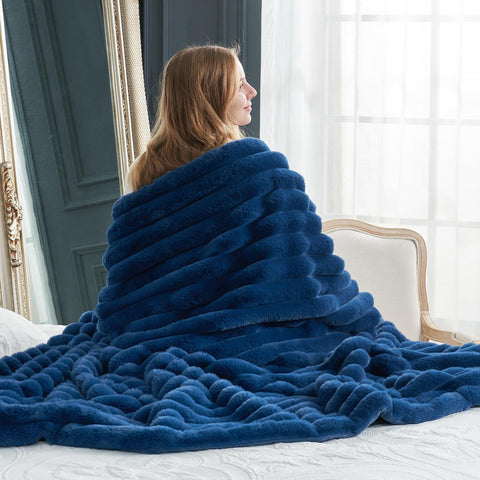Cozy Bliss folded throw on sofa offering quick styling and warmth benefit