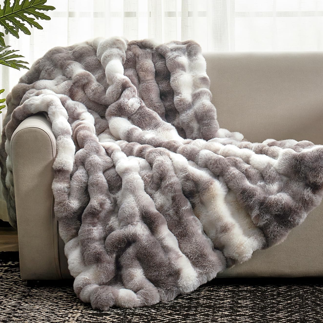 Cozy Bliss front view showing tie-dye taupe blanket on couch for elegant decor