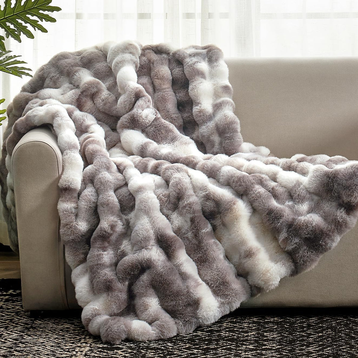 Cozy Bliss front view showing tie-dye taupe blanket on couch for elegant decor
