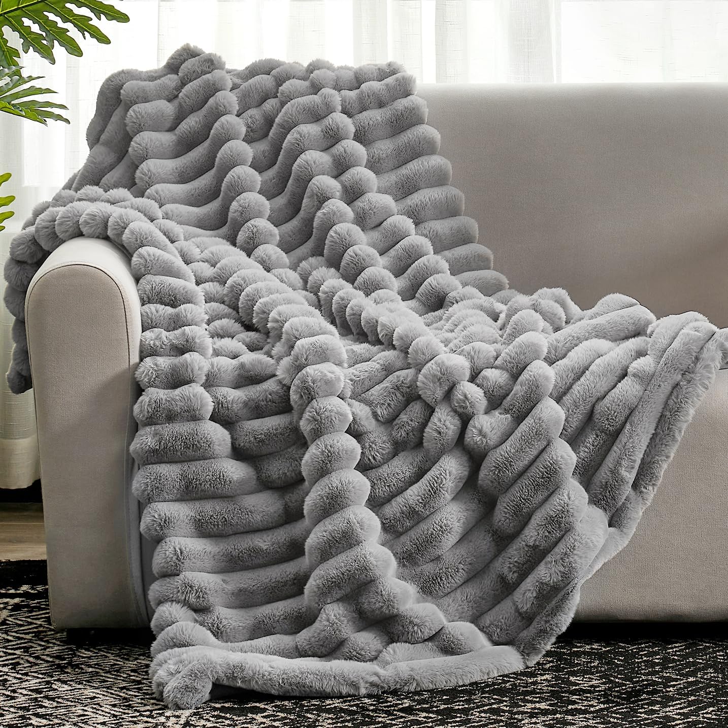 Cozy Bliss front view on sofa showing plush gray striped throw for cozy decor