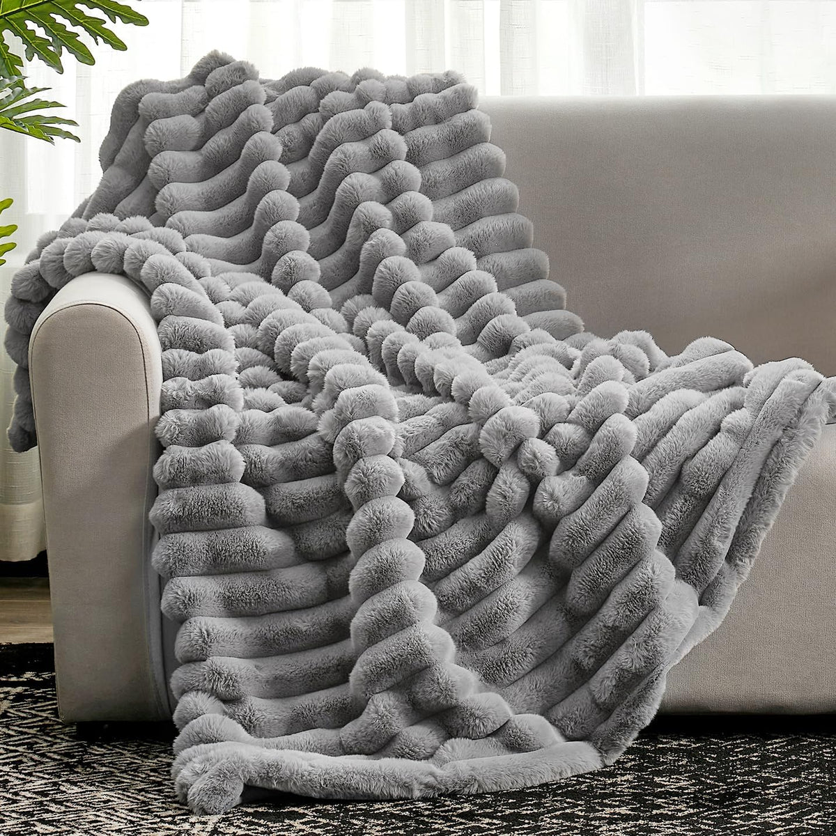 Cozy Bliss front view on sofa showing plush gray striped throw for cozy decor