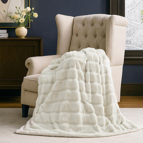 Cozy Bliss hands pressing plush surface, illustrates softness and loft