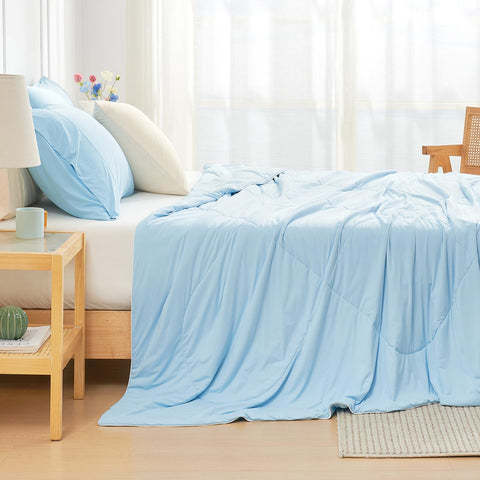 Cozy Bliss comforter styled on a queen bed promoting cool, comfortable bedroom sleep