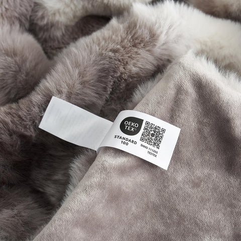 Cozy Bliss person wrapped in throw showing soft warmth and relaxation