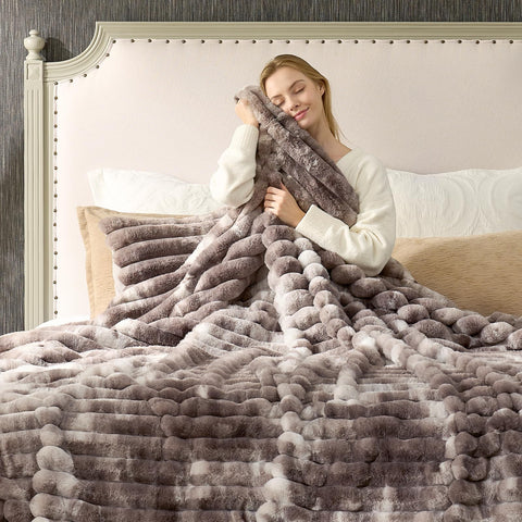 Cozy Bliss compared on chair to show 50 x 60 inch scale