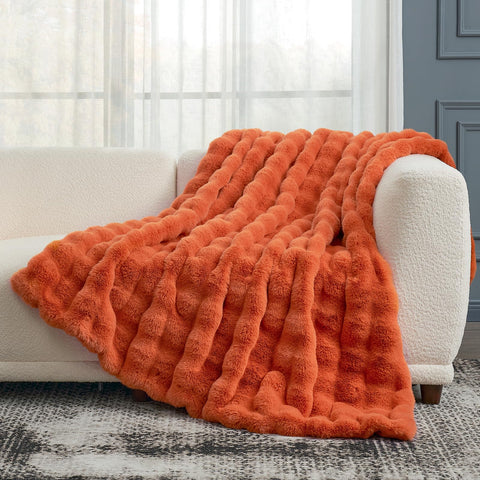 Cozy Bliss size comparison on chair illustrates 50x60 inch scale