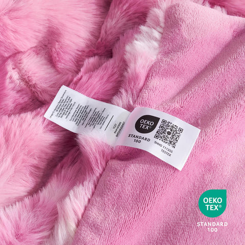 Cozy Bliss next to pillow showing 60x80 size and generous coverage