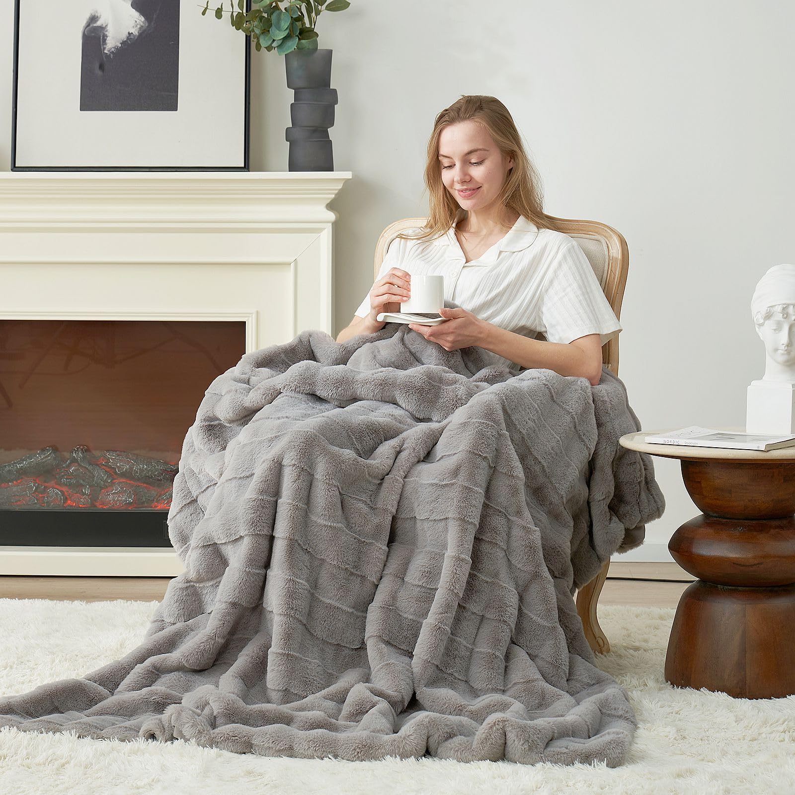 Cozy Bliss styled on sofa in living room adding refined cozy decor