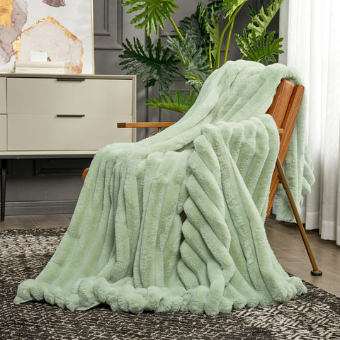 Cozy Bliss laid at bed footboard adding color and cozy layering