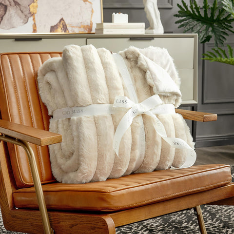 Cozy Bliss throw styled on sofa giving warm comfortable seating and visual depth