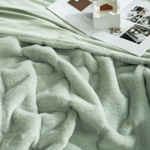Cozy Bliss paired with pillows showing layered styling and warmth benefit