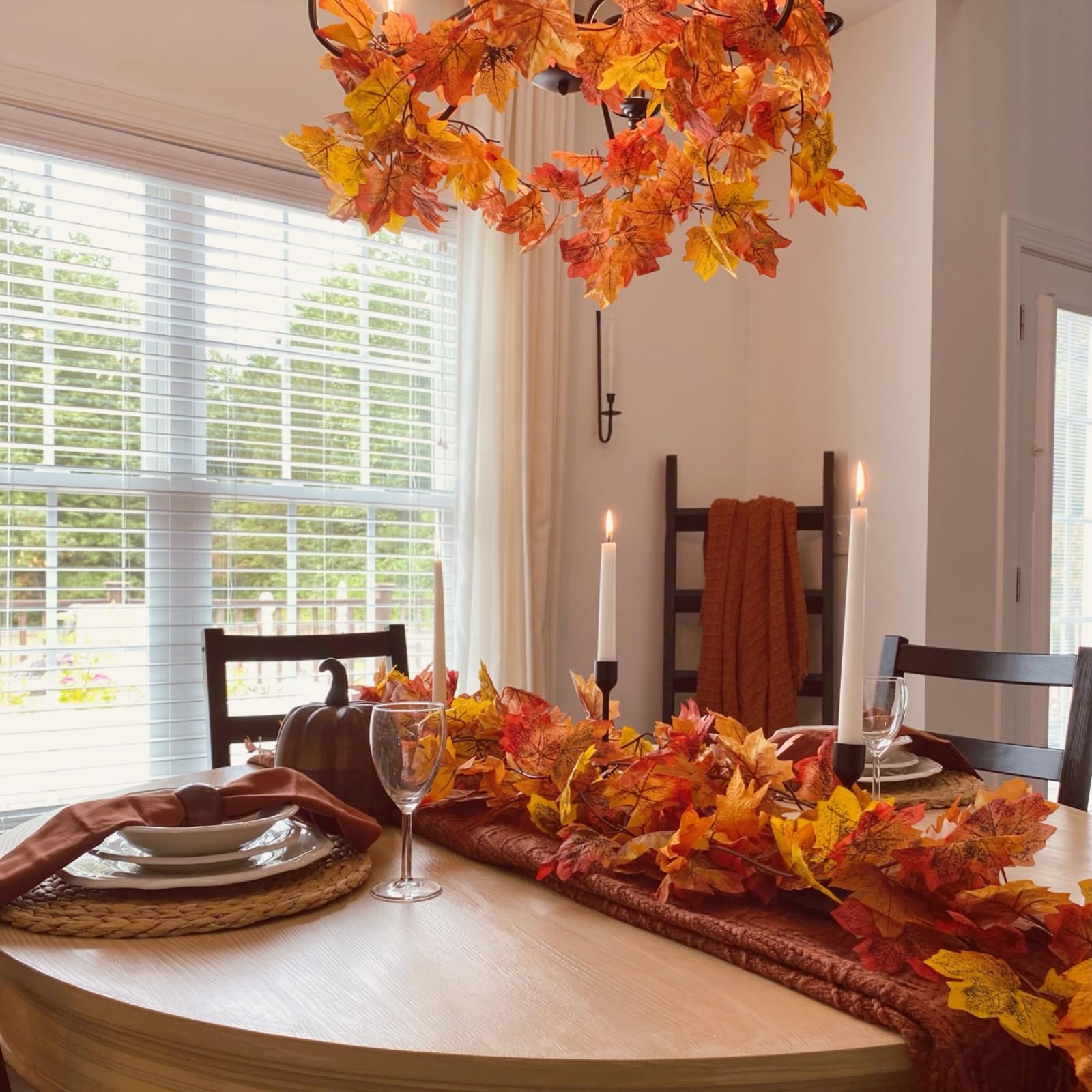 CQURE garland decorating a covered porch providing weather-resistant seasonal color benefit