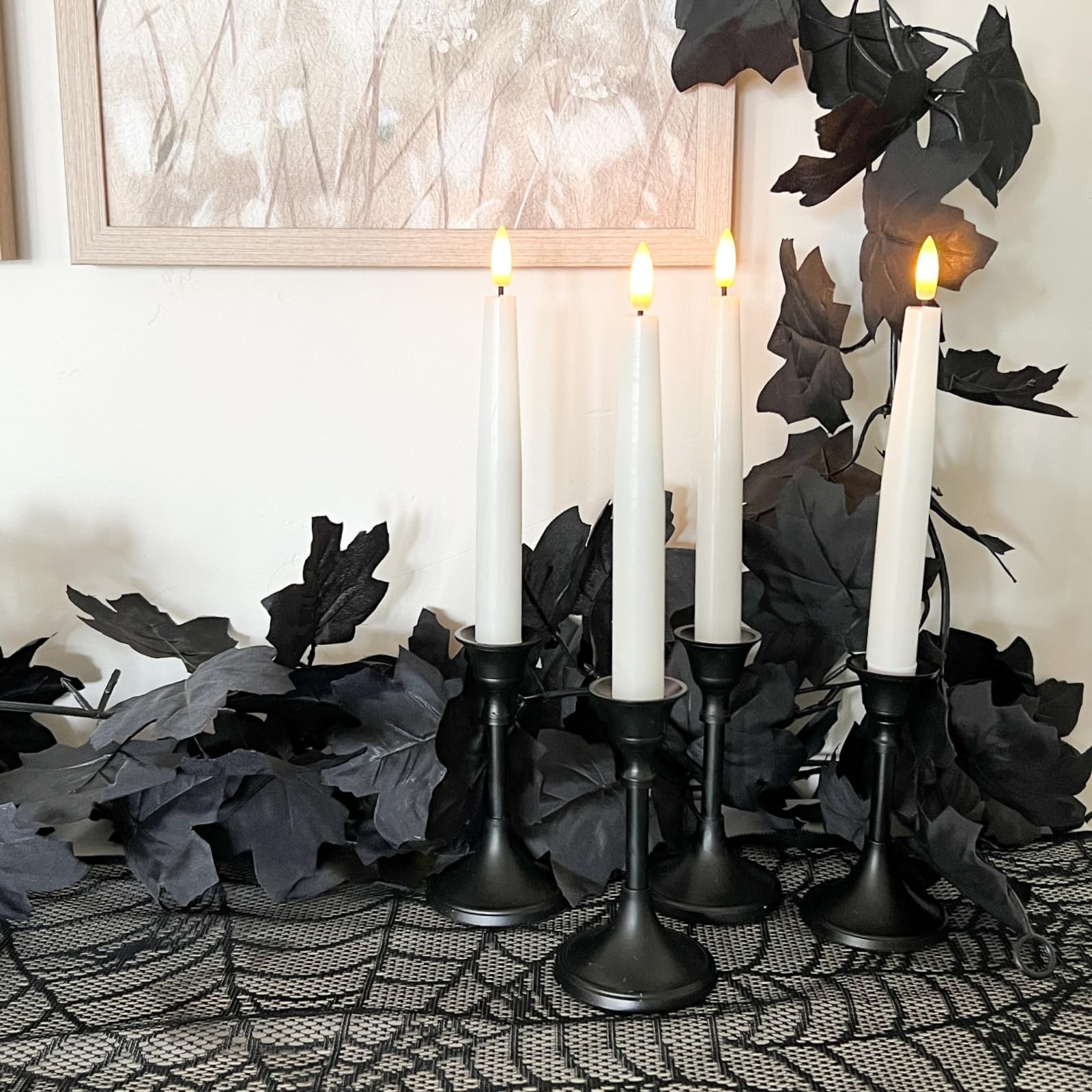 CQURE table centerpiece with garland and candles for dramatic Halloween or wedding decor