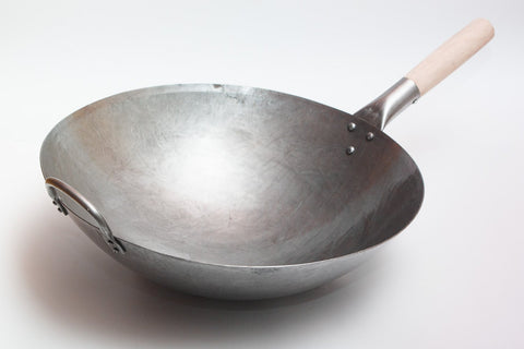 Craft Wok in use stir-fry over gas flame for fast searing benefit