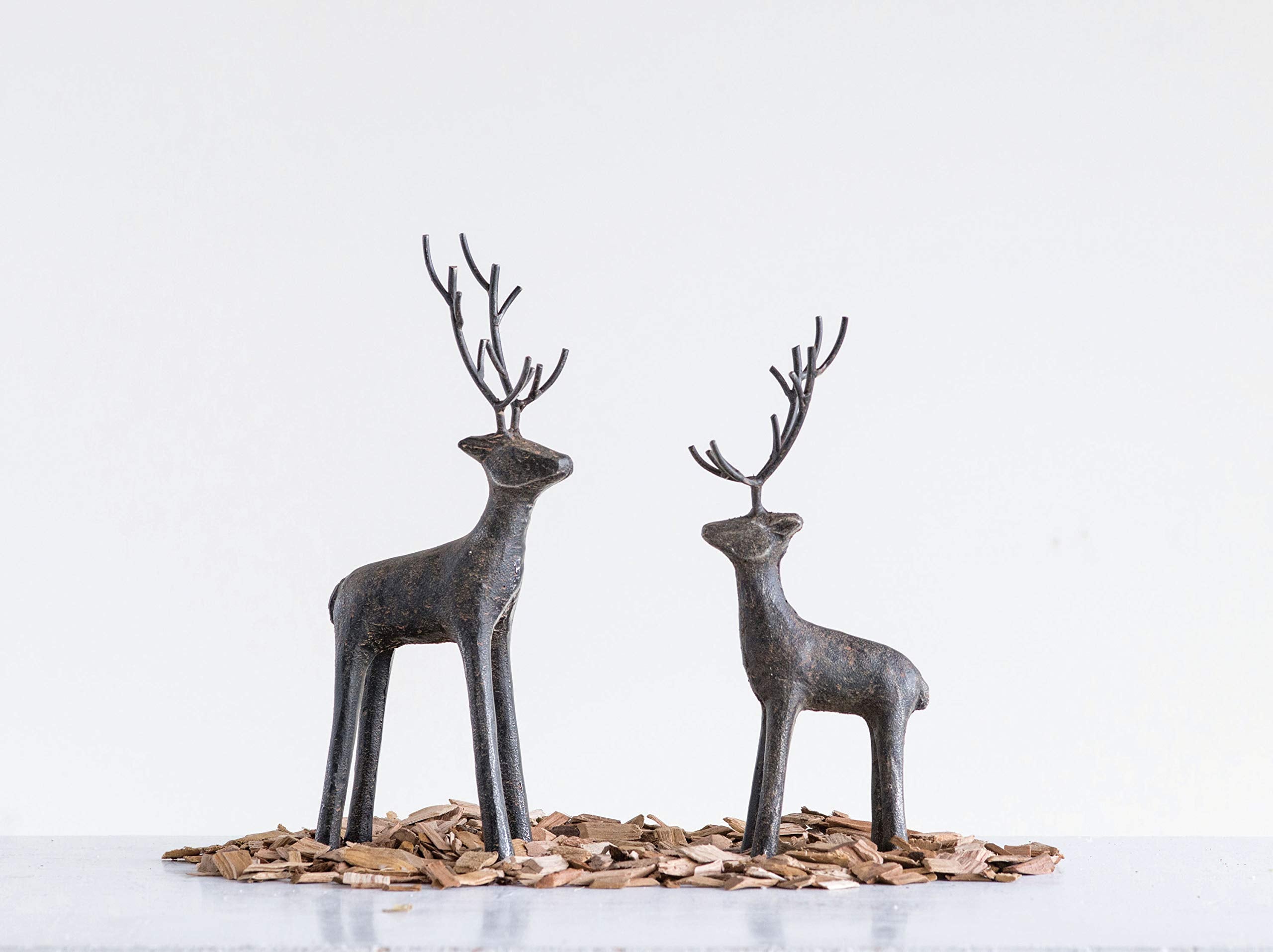 Creative Co-Op deer on mantel with garland showing scale and seasonal styling benefit